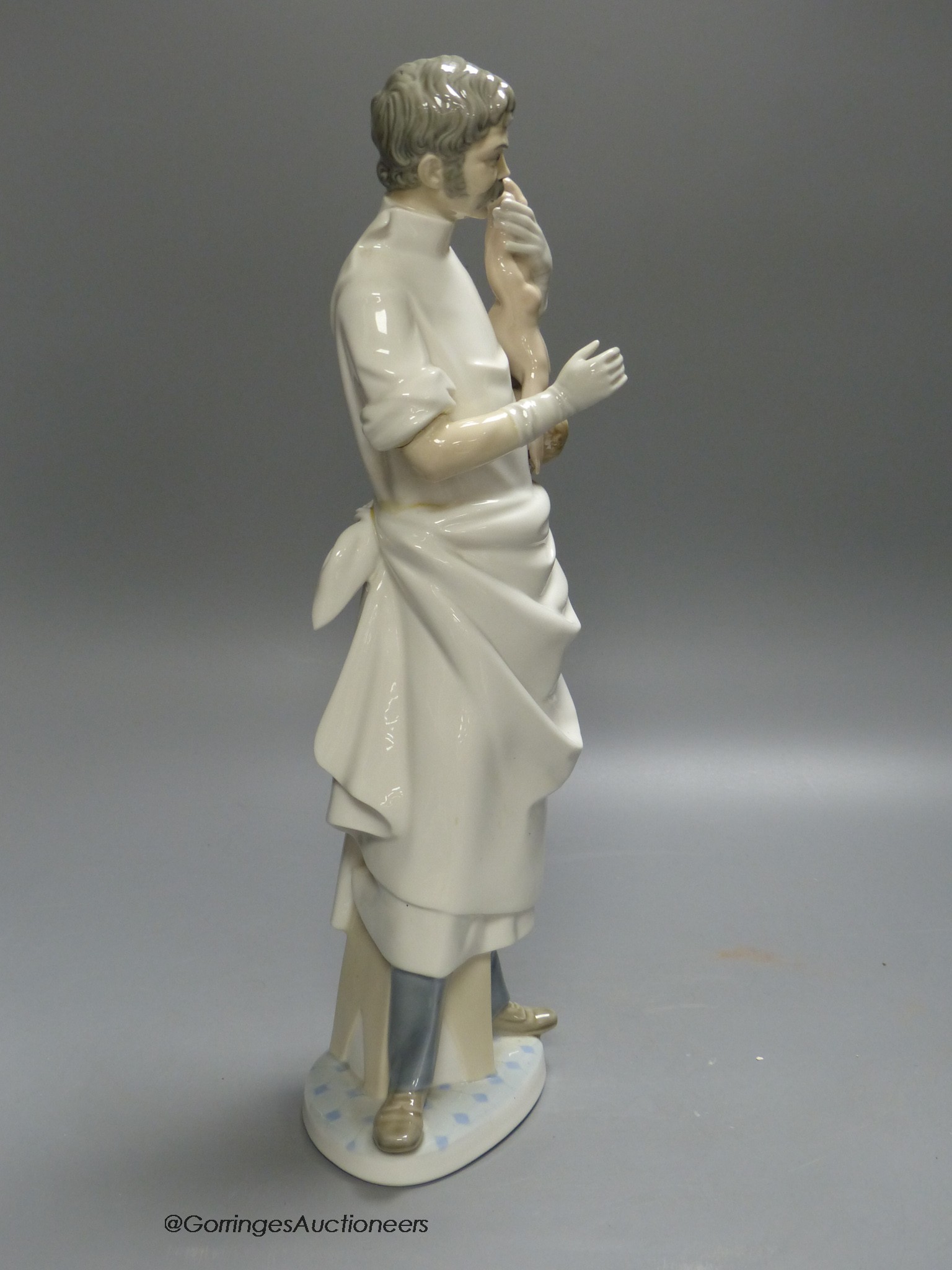 A Lladro figure of a doctor, 36cm high